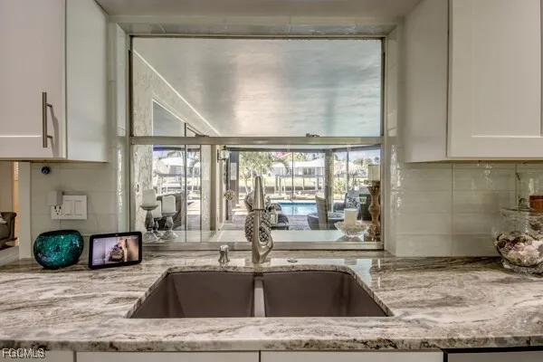 a bedroom with a large bed and a flat screen tv