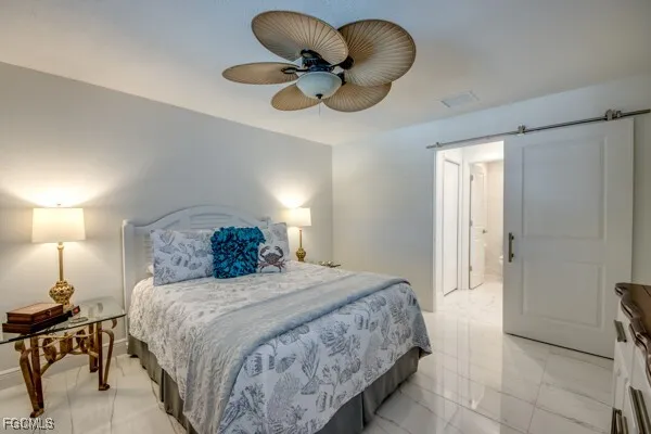 a spacious bathroom with a granite countertop sink a toilet and shower