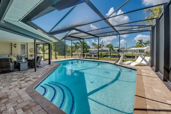a view of a swimming pool with a patio