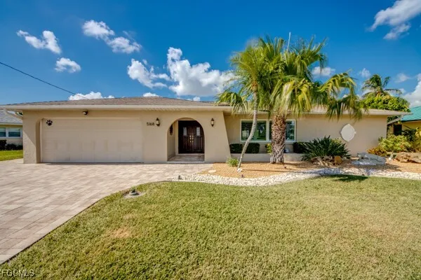 a large kitchen with stainless steel appliances granite countertop a lot of counter space and a sink