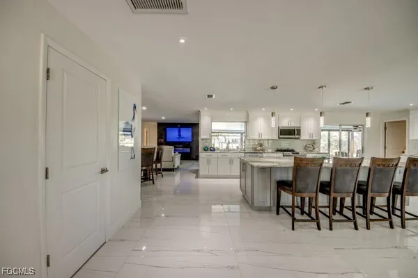 a kitchen with sink and window