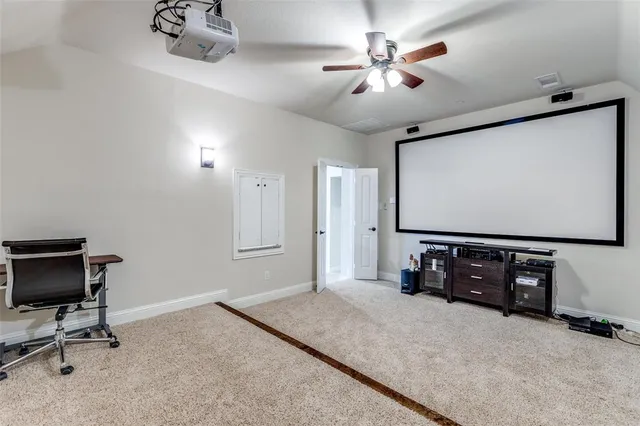 a living room with a rug and a table