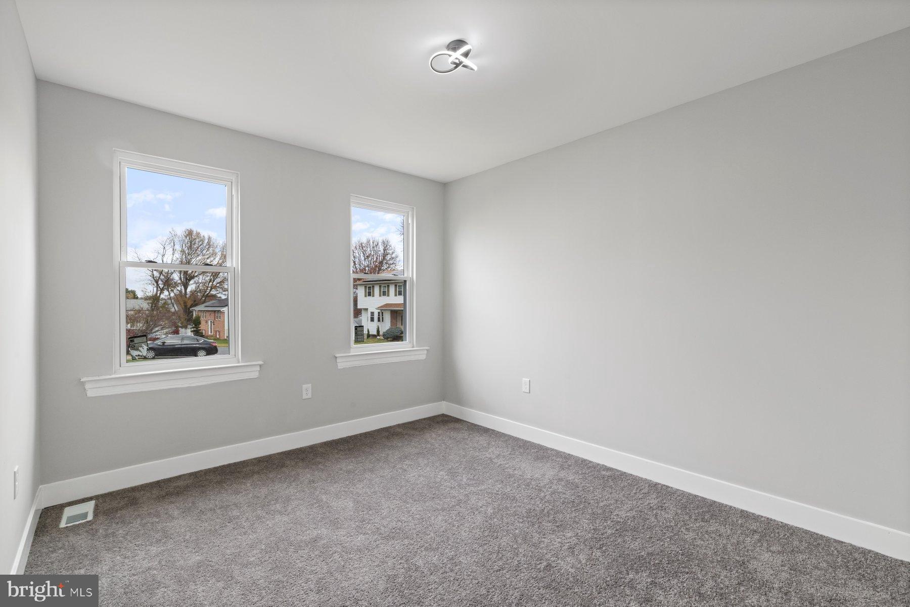 4632 Old Court Road Pikesville, MD 21208 - Photo 19 of 34 an empty room with windows
