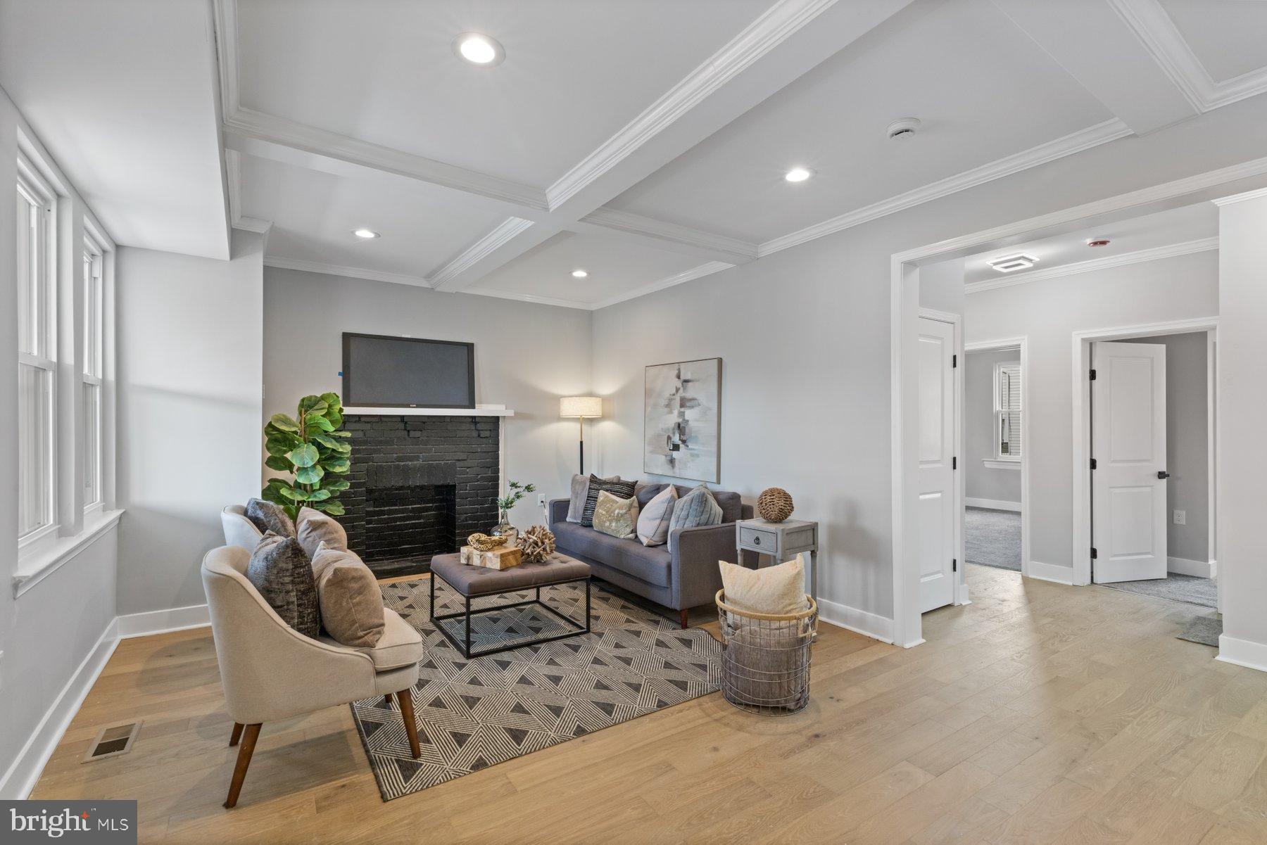 4632 Old Court Road Pikesville, MD 21208 - Photo 2 of 34 a living room with furniture and a fireplace