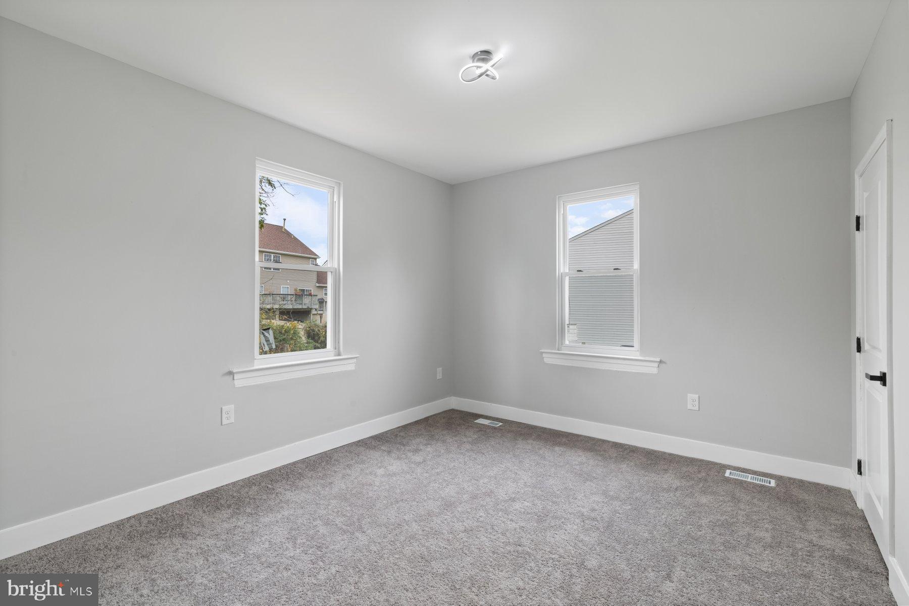 4632 Old Court Road Pikesville, MD 21208 - Photo 21 of 34 an empty room with windows and closet