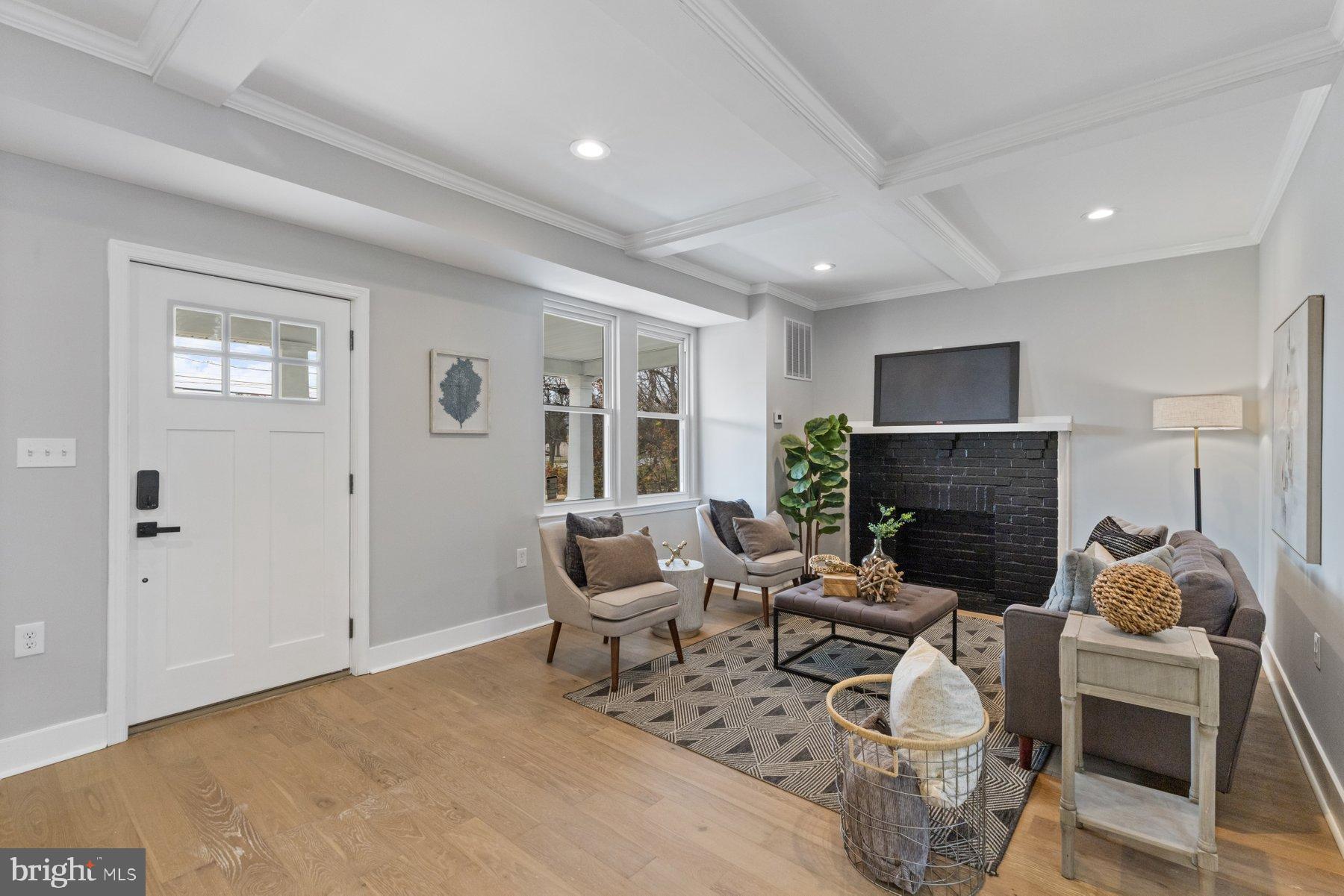 4632 Old Court Road Pikesville, MD 21208 - Photo 3 of 34 a living room with furniture and a fireplace