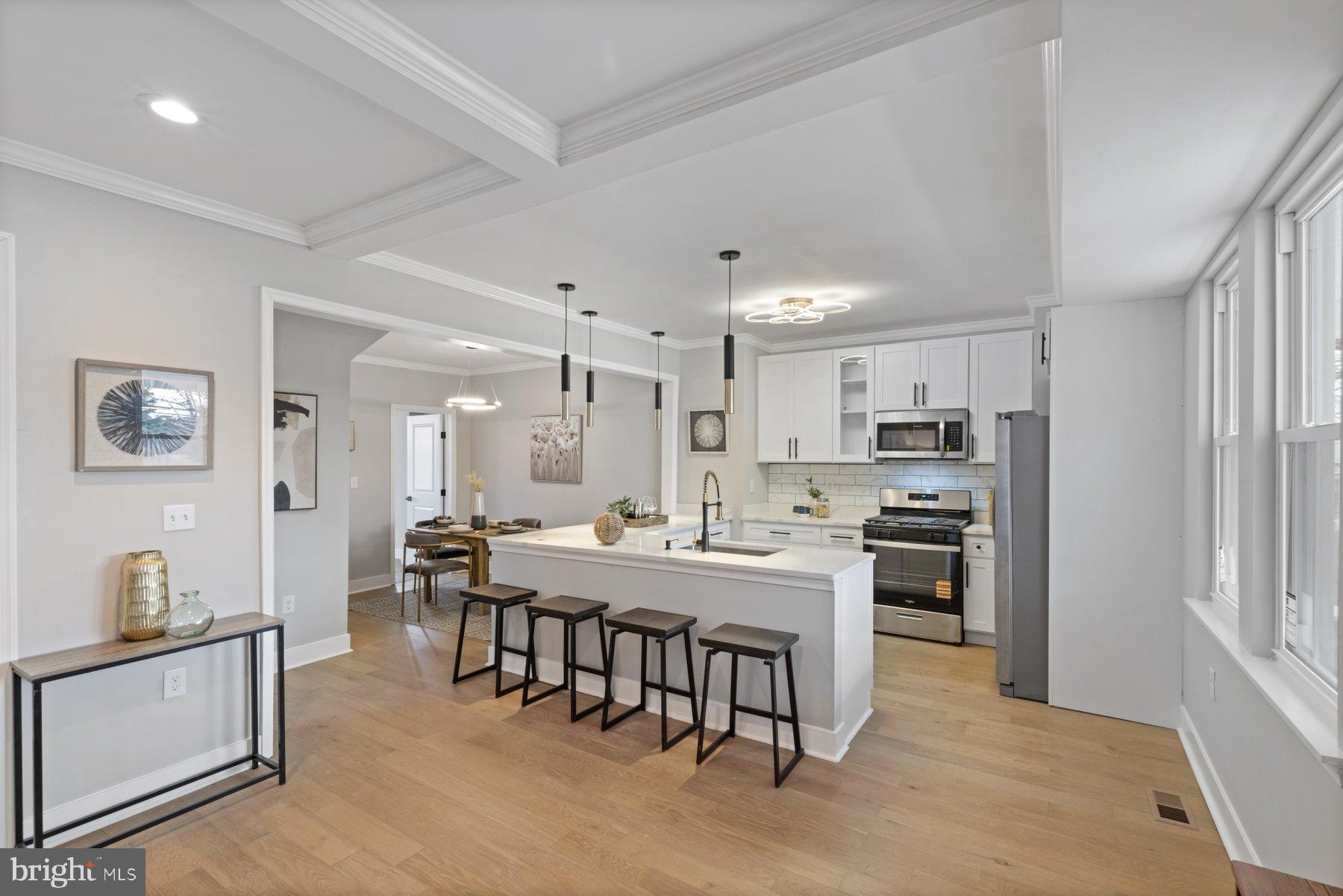 4632 Old Court Road Pikesville, MD 21208 - Photo 5 of 34 a large kitchen with a table and chairs