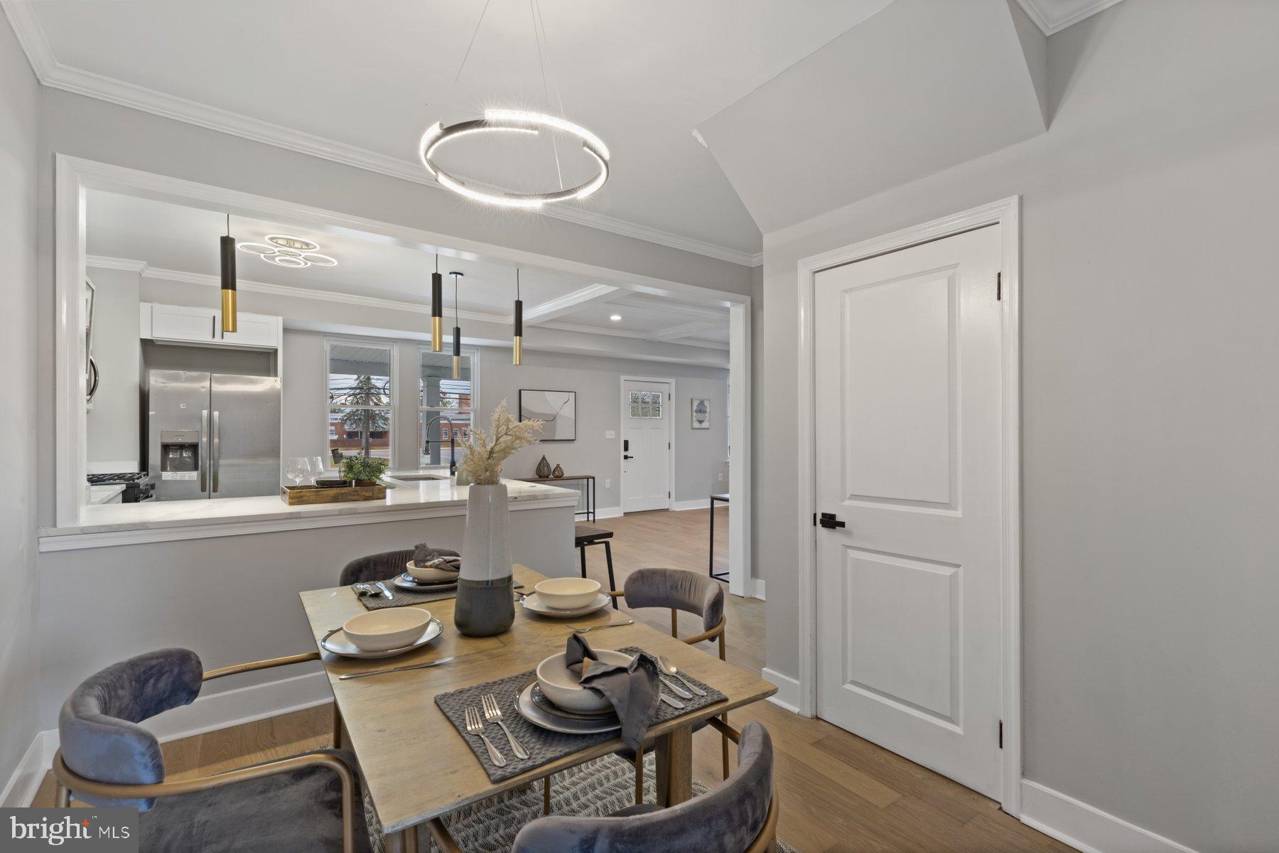 4632 Old Court Road Pikesville, MD 21208 - Photo 10 of 34 a living room with furniture and a chandelier