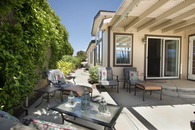 a view of a house and outdoor seating