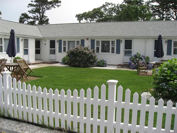 178 Captain Chase Road, Unit 12 Dennis, MA 02639 - Photo 2 of 4 a front view of house with yard and green space