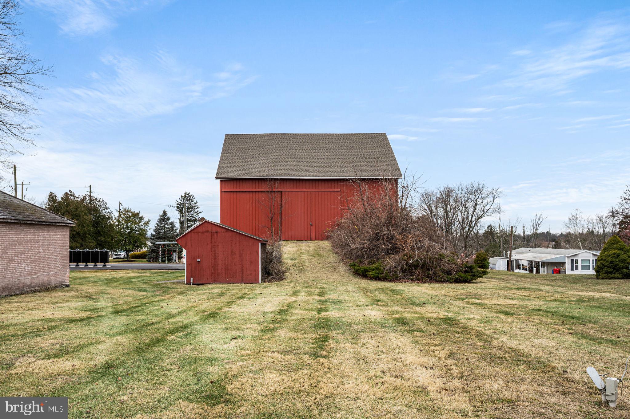 2933 East High Street Pottstown, PA 19464 - Photo 14 of 22 a backyard of a house with table and chairs
