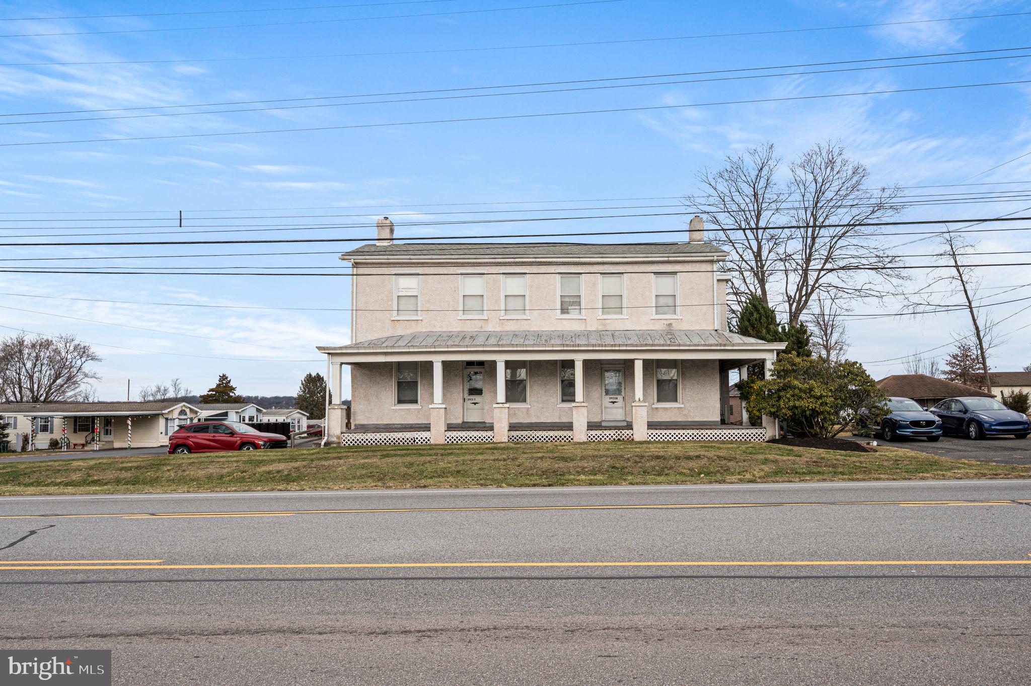 2933 East High Street Pottstown, PA 19464 - Photo 6 of 22 a front view of a house with a garden