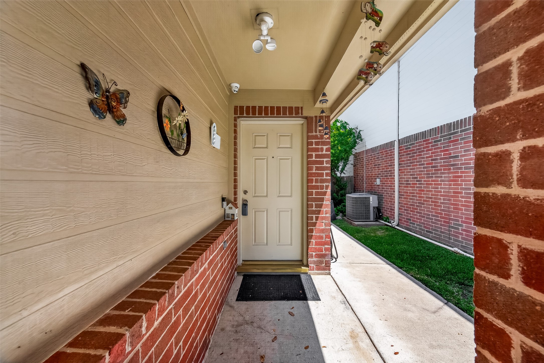 19322 Dawn Canyon Road Houston, TX 77084 - Photo 4 of 37 This photo shows a welcoming entryway featuring a covered porch with brick accents.