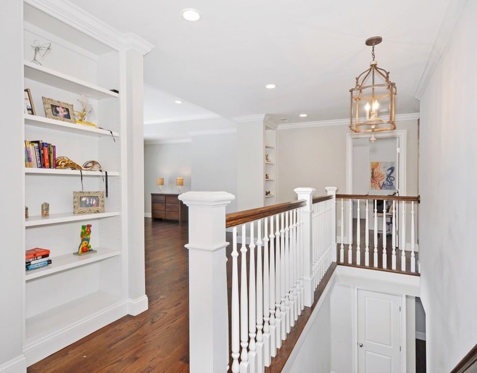 291 Monsen Road Concord, MA 01742 - Photo 15 of 26 a view of a hallway with entryway and chandelier
