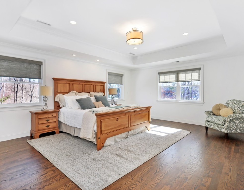 291 Monsen Road Concord, MA 01742 - Photo 16 of 26 a spacious bedroom with a bed and a couch