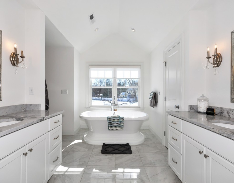 291 Monsen Road Concord, MA 01742 - Photo 17 of 26 a spacious bathroom with a granite countertop sink mirror and toilet