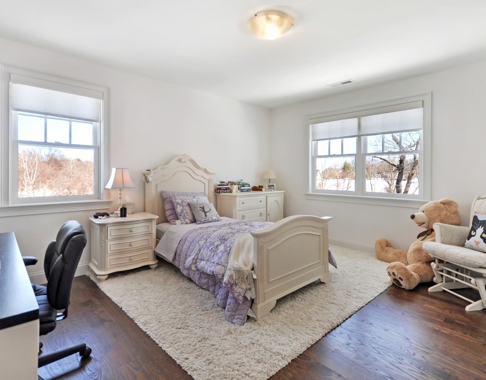 291 Monsen Road Concord, MA 01742 - Photo 20 of 26 a bedroom with a bed and windows