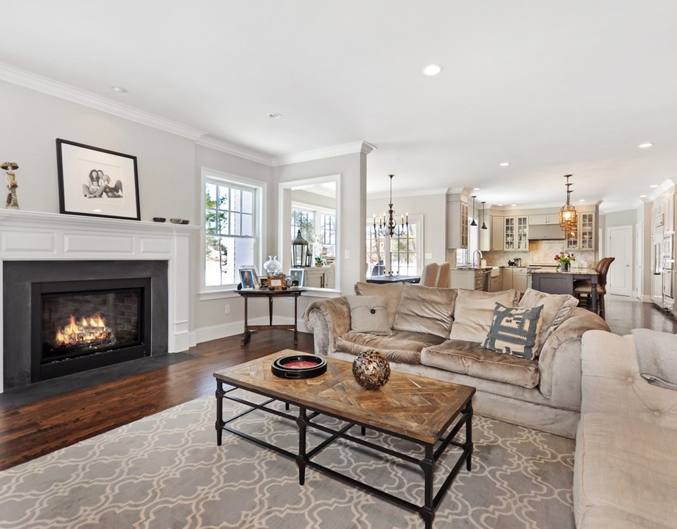 291 Monsen Road Concord, MA 01742 - Photo 2 of 26 a living room with furniture a fireplace and a table