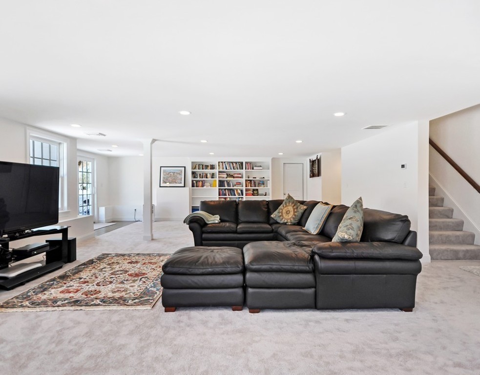 291 Monsen Road Concord, MA 01742 - Photo 22 of 26 a living room with furniture and a flat screen tv