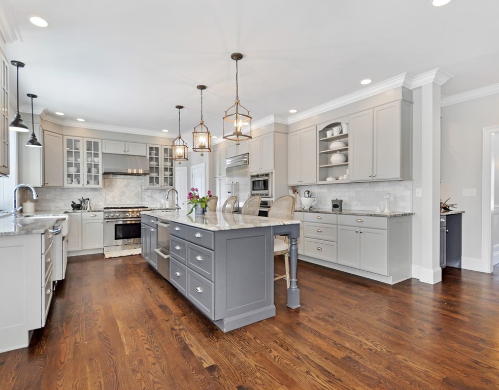 291 Monsen Road Concord, MA 01742 - Photo 3 of 26 a large kitchen with stainless steel appliances sink a microwave and cabinets
