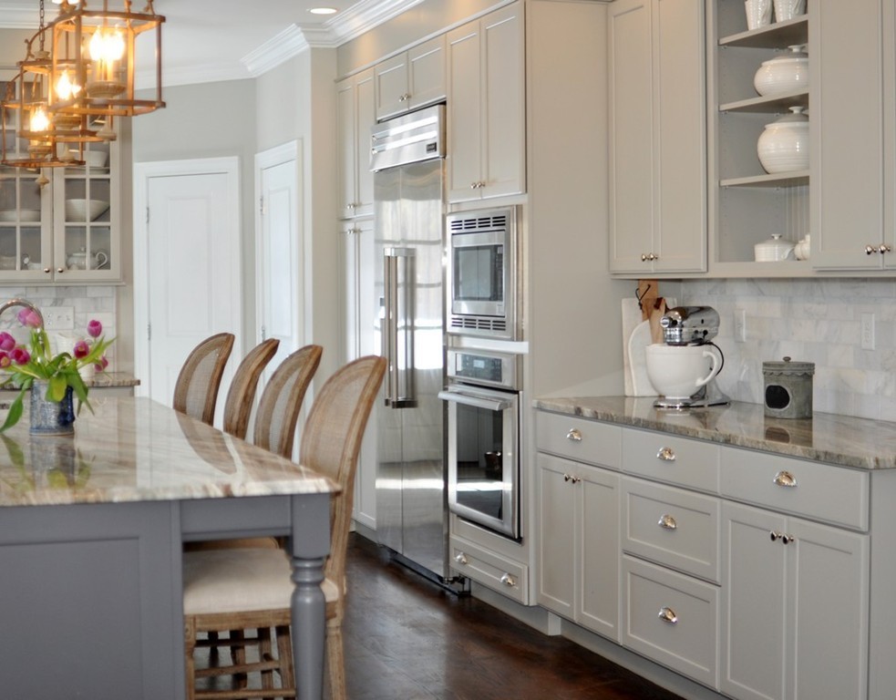 291 Monsen Road Concord, MA 01742 - Photo 5 of 26 a kitchen with granite countertop a sink a stove and cabinets