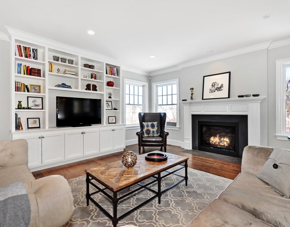 291 Monsen Road Concord, MA 01742 - Photo 8 of 26 a living room with furniture a rug and a fireplace