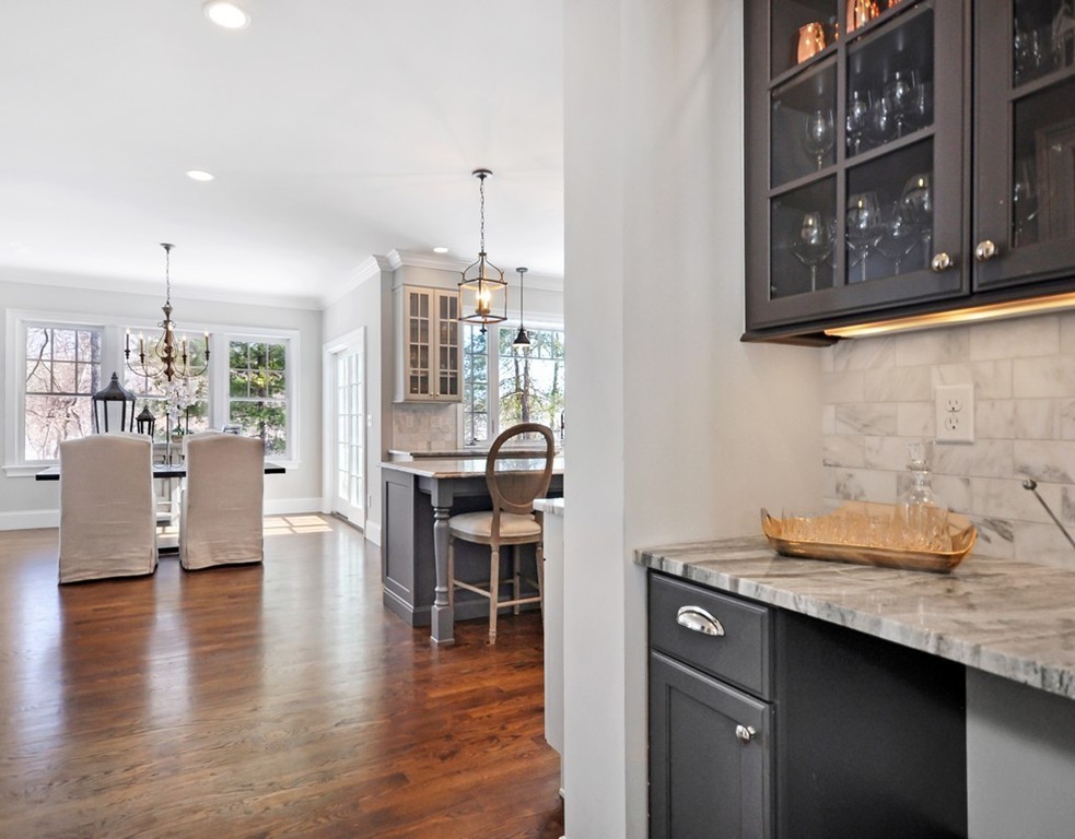 291 Monsen Road Concord, MA 01742 - Photo 10 of 26 a kitchen with granite countertop a sink cabinets and wooden floor