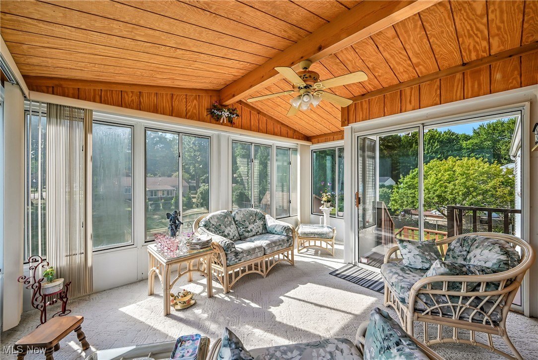 7797 Raglan Drive Northeast Warren, OH 44484 - Photo 24 of 50 Sunroom featuring a ceiling fan and an outdoor living space