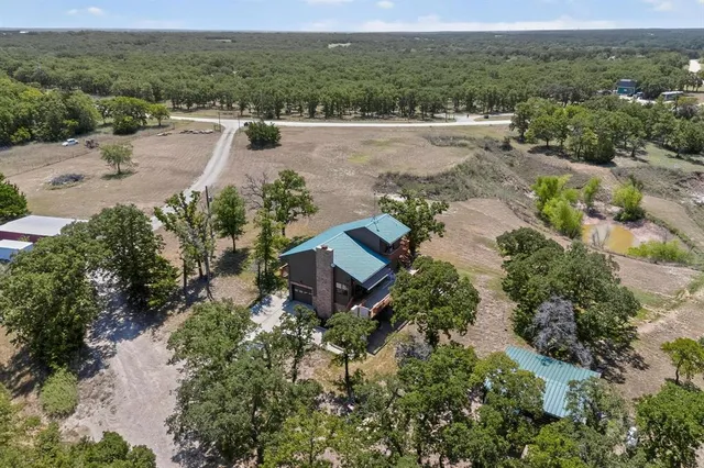 an aerial view of a house with a garden