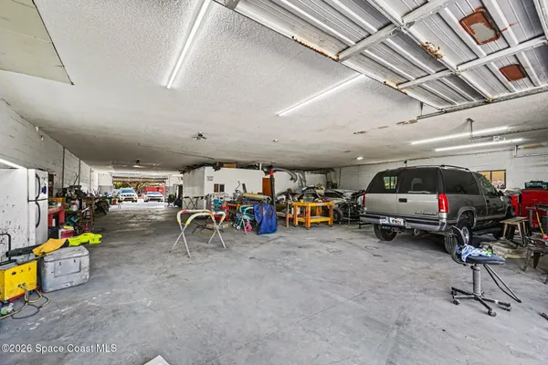 a view of parking garage with cars