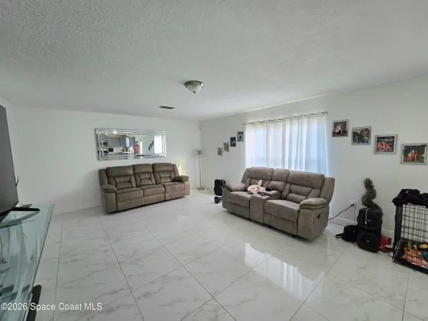 a living room with furniture and a couch