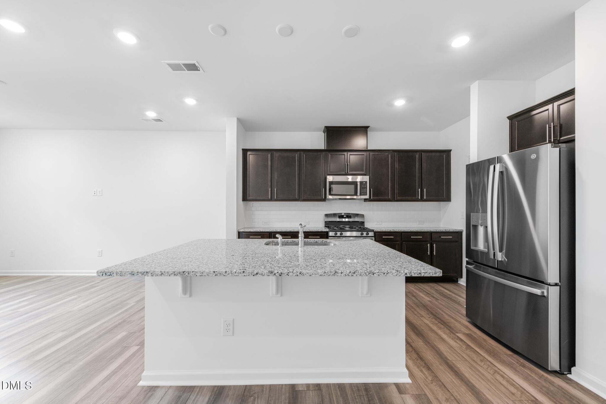 127 Tree Moss Court Rolesville, NC 27571 - Photo 3 of 30 SUN_ParkerRidge_Pic_CarsonII_QMI_30_Kitc