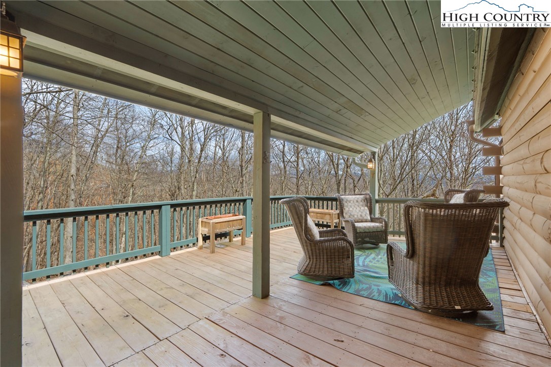 1748 Junaluska Road Boone, NC 28607 - Photo 5 of 37 a view of balcony with couch and chairs