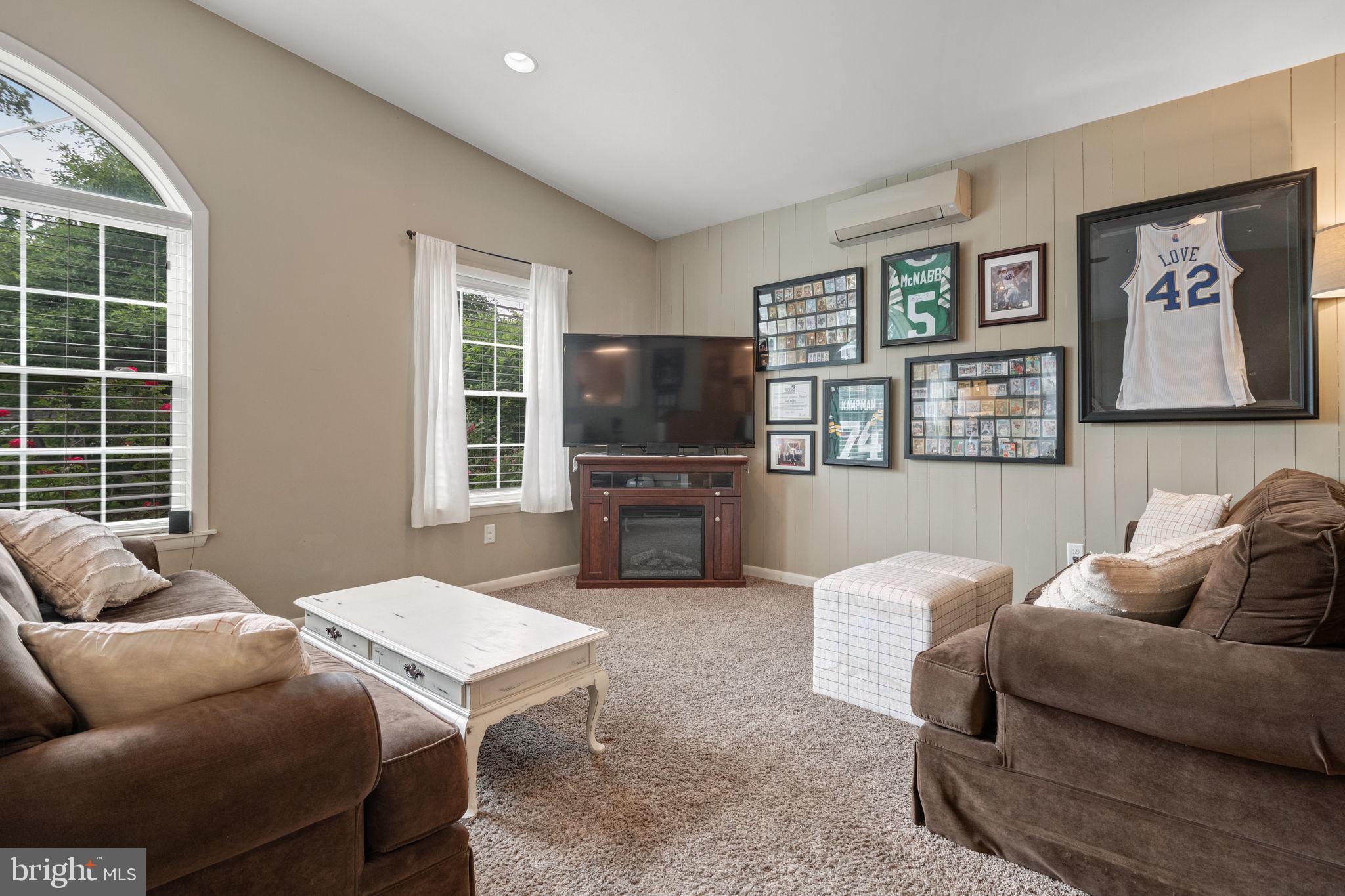 1818 Longview Drive Lancaster, PA 17601 - Photo 18 of 49 a living room with furniture a window and a flat screen tv