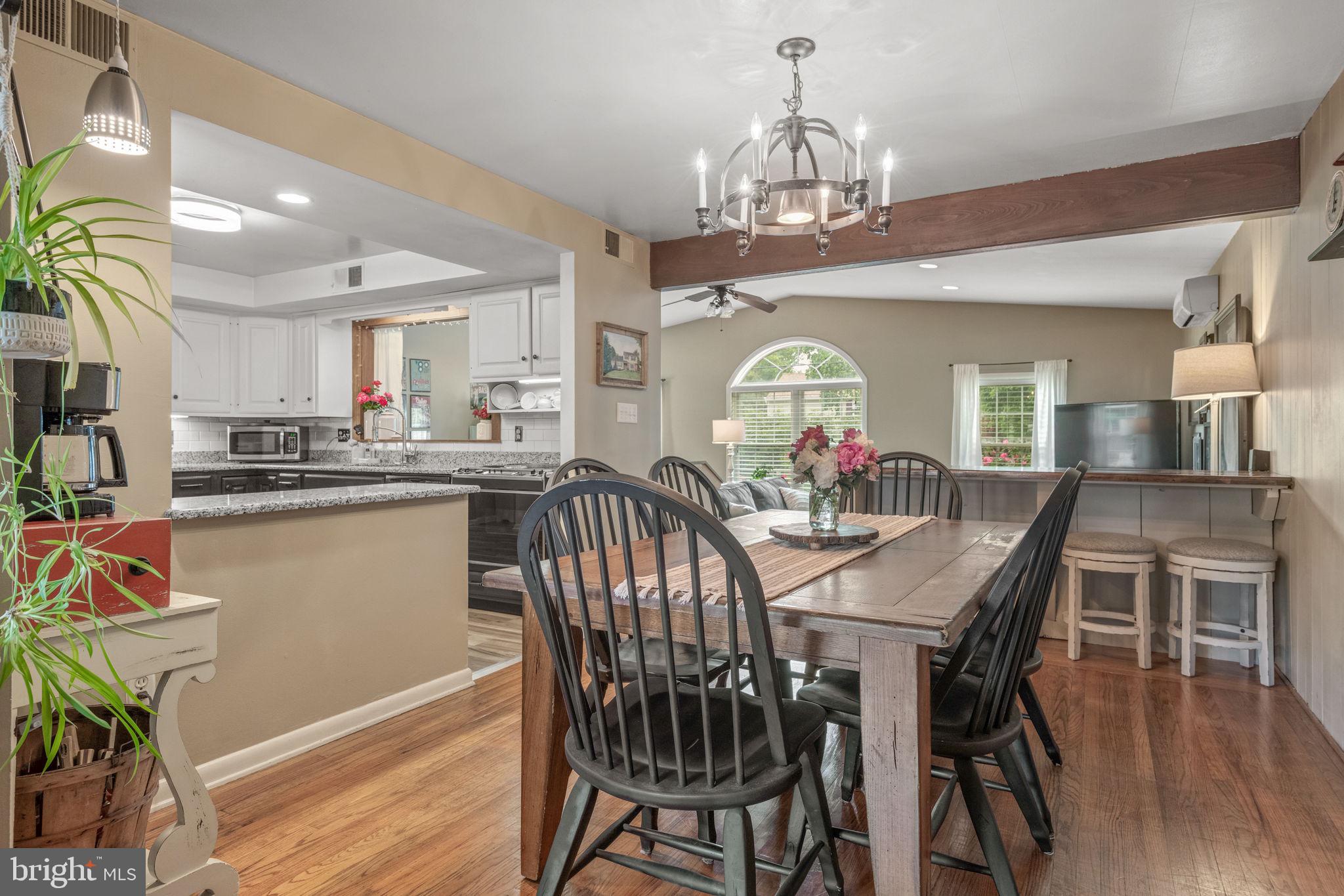 1818 Longview Drive Lancaster, PA 17601 - Photo 10 of 49 a view of a dining room with furniture a chandelier and wooden floor