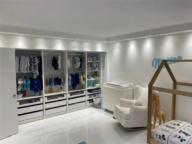 a living room with furniture and white walls