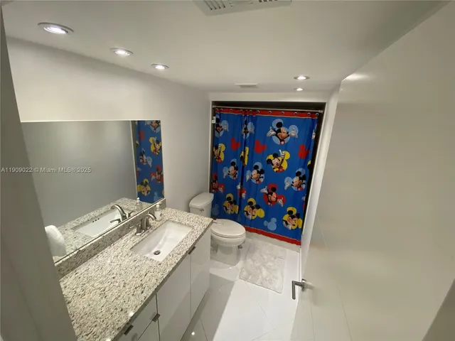 a bathroom with a sink a vanity and a mirror