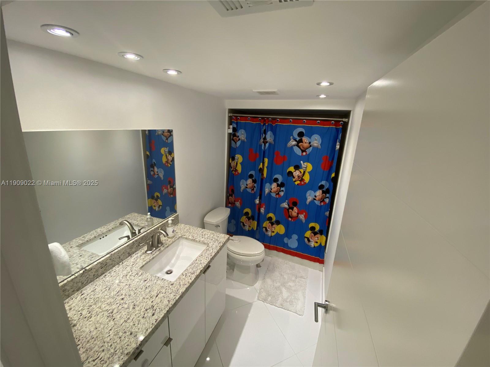 121 Crandon Boulevard, Unit 351 Key Biscayne, FL 33149 - Photo 15 of 15 a bathroom with a sink a vanity and a mirror