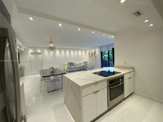 a kitchen that has a sink and a stove