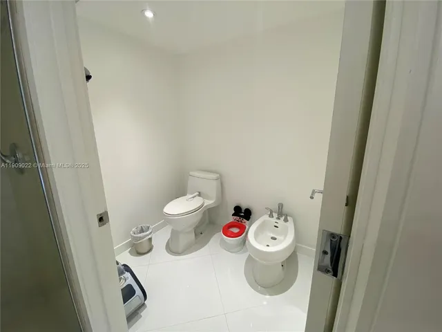a bathroom with a toilet and a sink