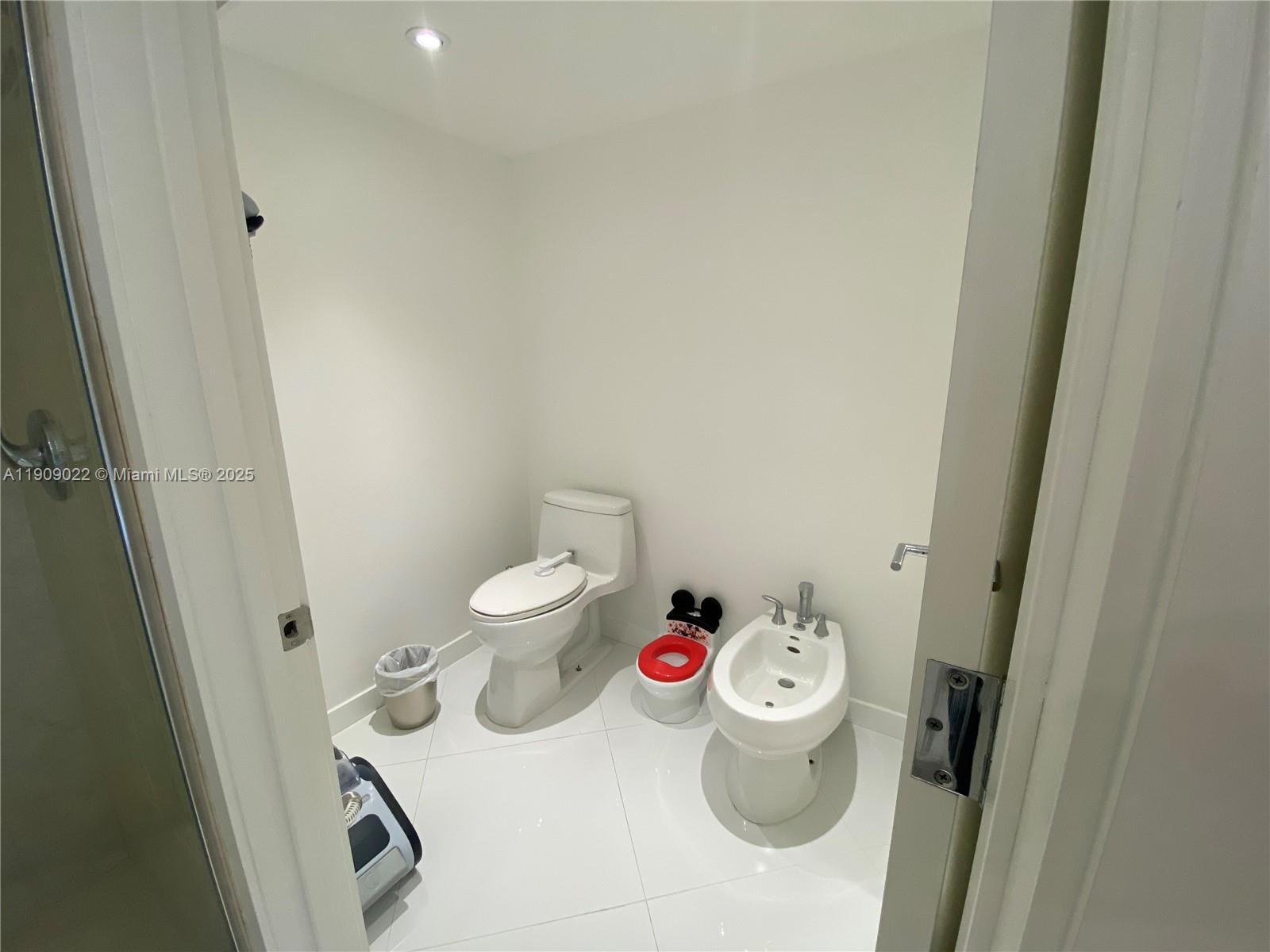 121 Crandon Boulevard, Unit 351 Key Biscayne, FL 33149 - Photo 10 of 15 a bathroom with a toilet and a sink
