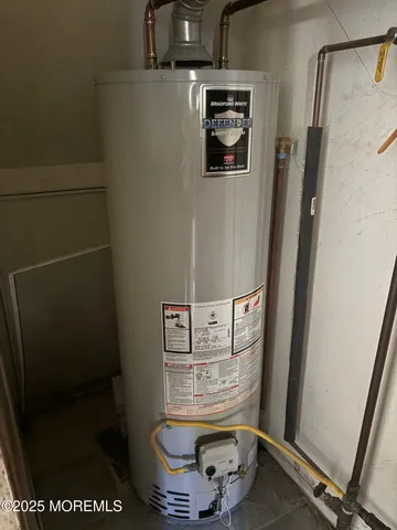 a bathroom with a sink a toilet and a shower