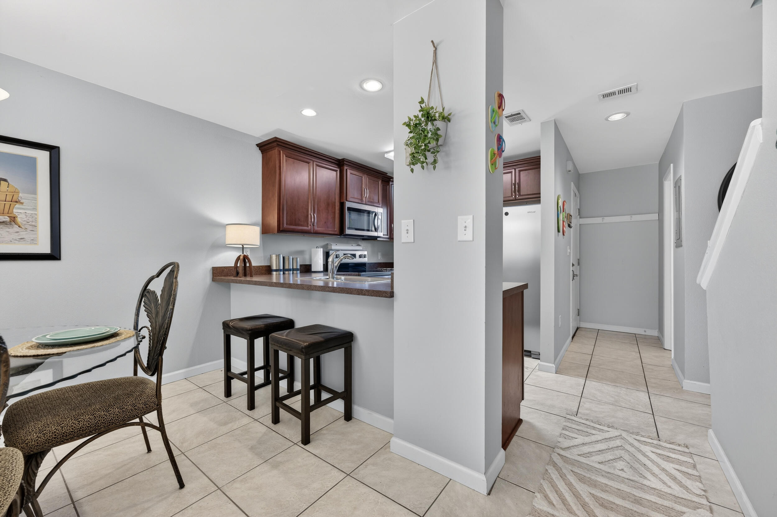 17620 Front Beach Road, Unit BB6 Panama City Beach, FL 32413 - Photo 11 of 47 a view of a dining room with furniture