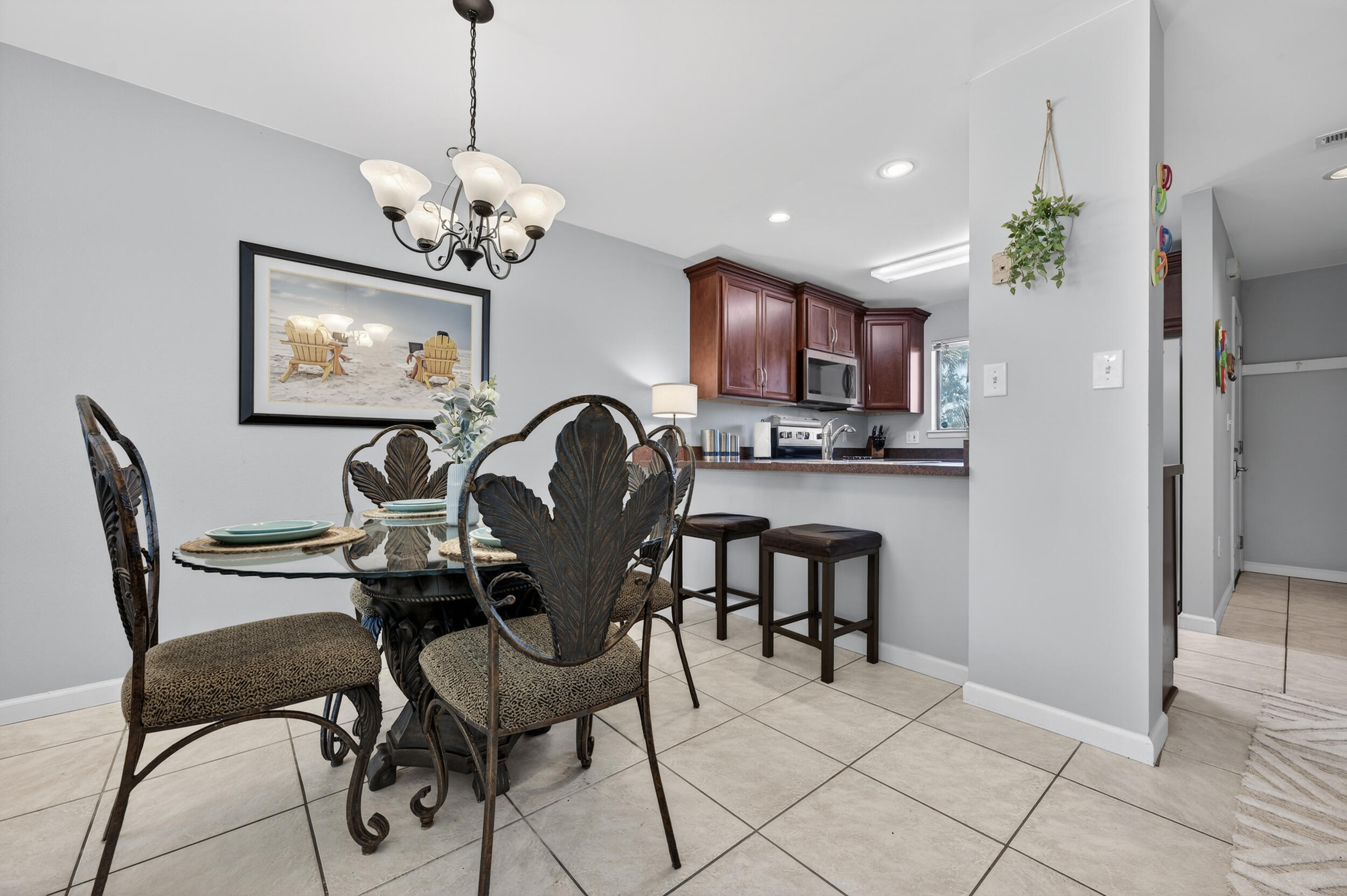 17620 Front Beach Road, Unit BB6 Panama City Beach, FL 32413 - Photo 11 of 47 a view of a dining room with furniture and a chandelier