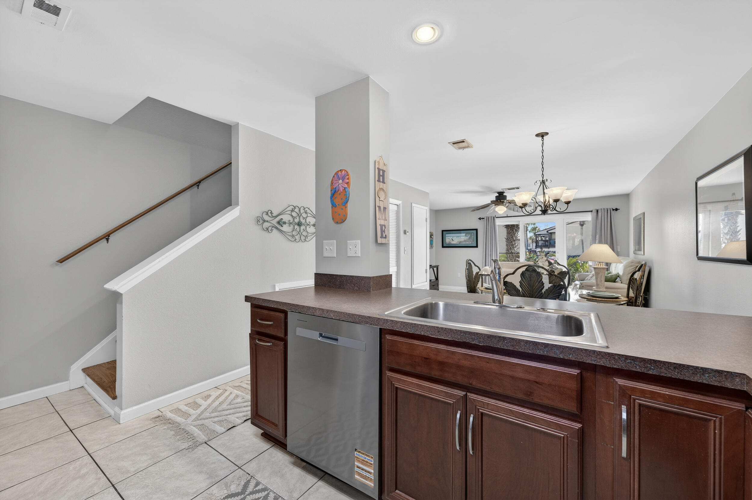 17620 Front Beach Road, Unit BB6 Panama City Beach, FL 32413 - Photo 16 of 47 a kitchen with a sink and cabinets