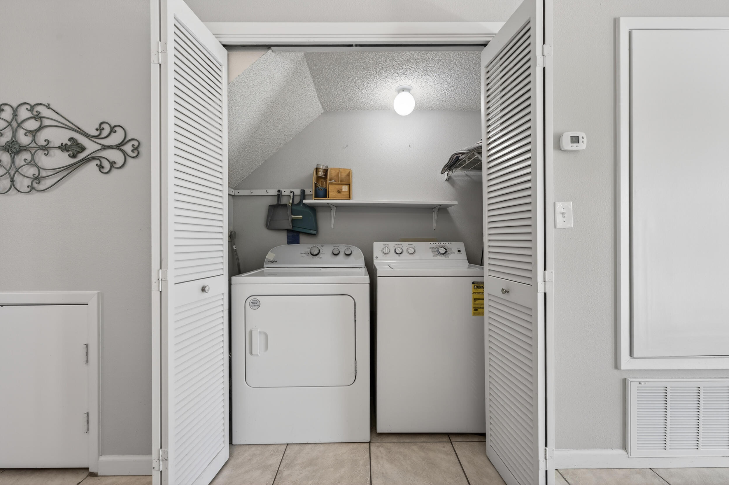 17620 Front Beach Road, Unit BB6 Panama City Beach, FL 32413 - Photo 19 of 47 a view of storage and utility room with washer and dryer