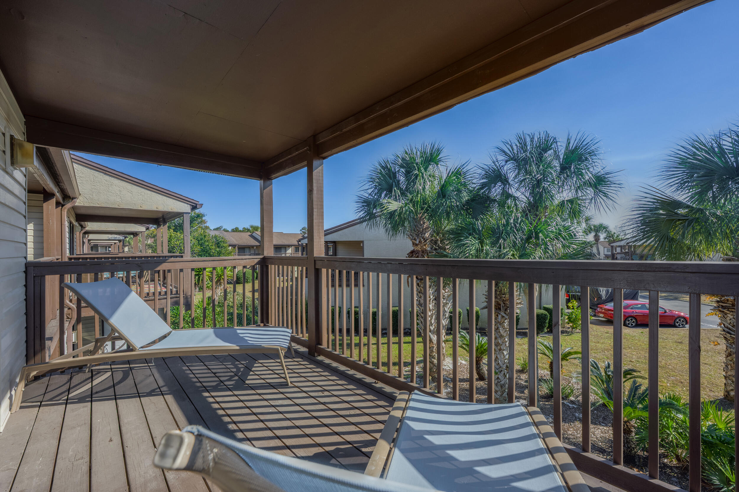 17620 Front Beach Road, Unit BB6 Panama City Beach, FL 32413 - Photo 27 of 47 a view of balcony with wooden floor and fence