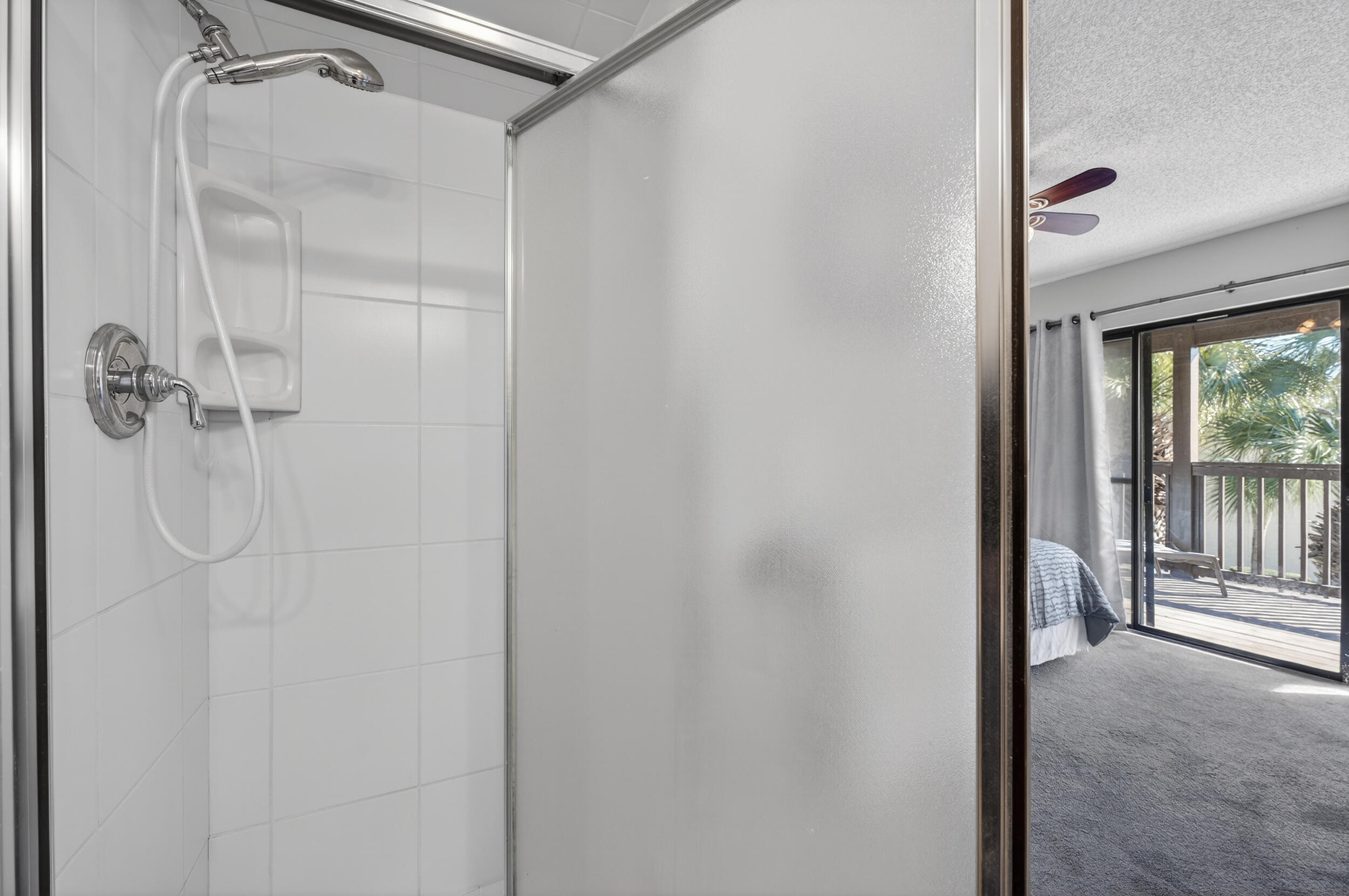 17620 Front Beach Road, Unit BB6 Panama City Beach, FL 32413 - Photo 29 of 47 a bathroom with a glass shower door