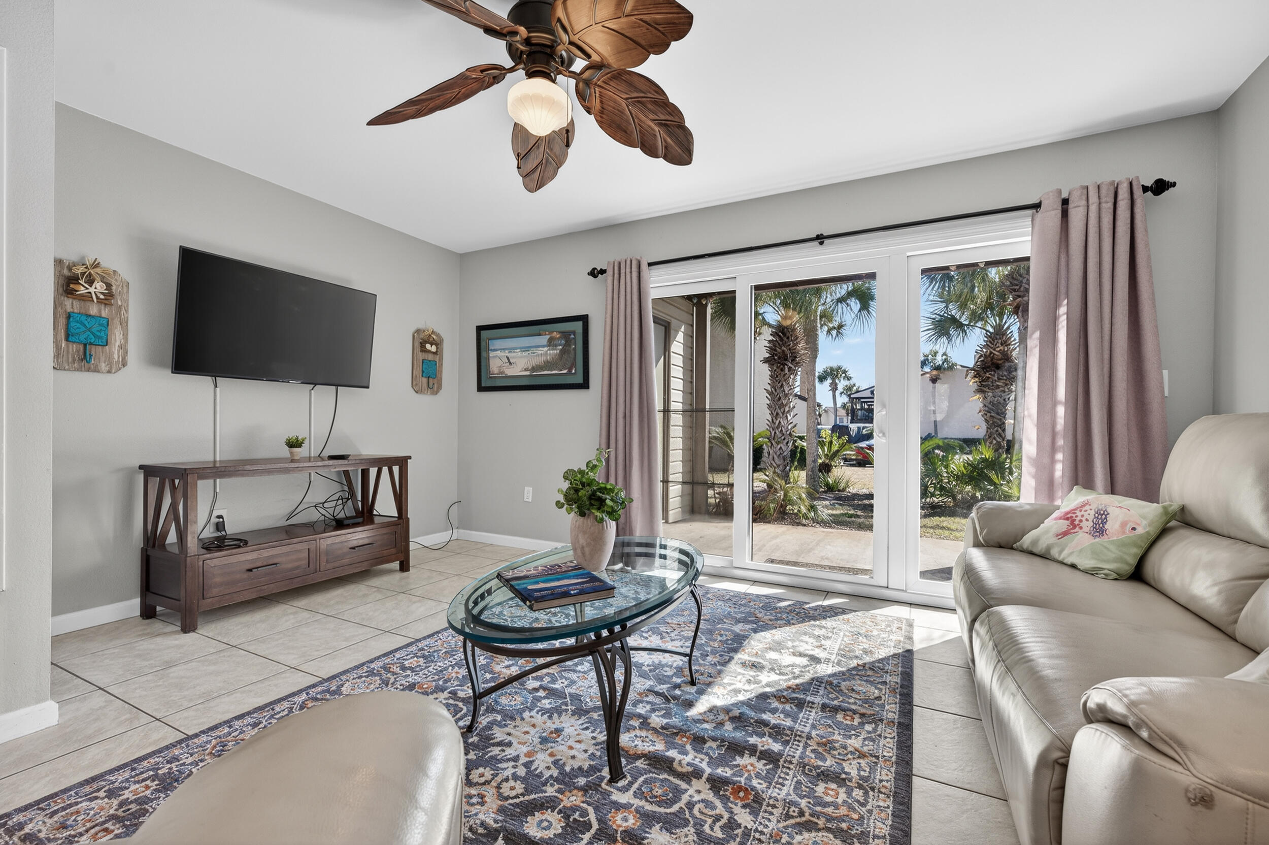 17620 Front Beach Road, Unit BB6 Panama City Beach, FL 32413 - Photo 5 of 47 a living room with furniture and a flat screen tv