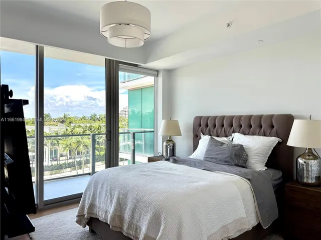 a dining room with furniture and a window